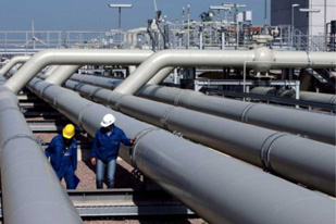 Two employees control the pipeline systems of the new compressor tube owned by natural gas provider Wingas a German-Russion cooperation of which 35 percent belong to Gazprom