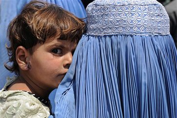 Woman in burqa w/child
