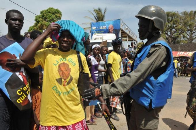 A member of the security stops a support