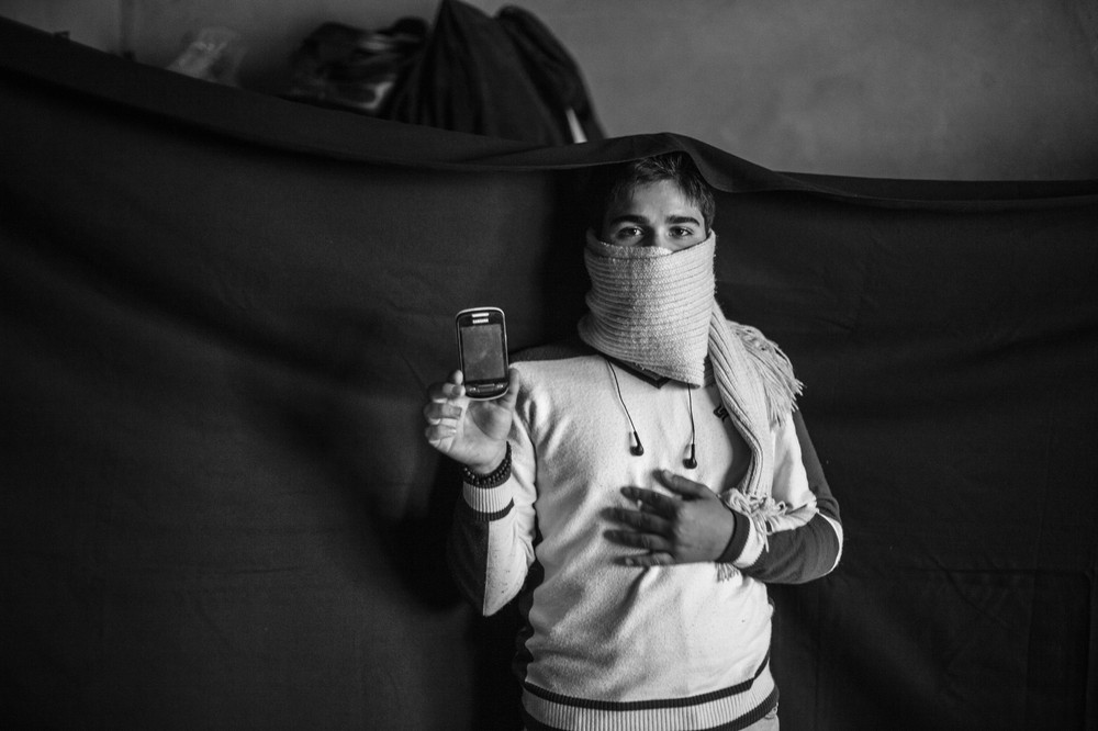 Yusuf and his family fled their home several months before this photograph was taken.
The most important thing he was able to bring from Syria is the mobile phone that he holds in this photograph. "With this, I(***)m able to call my father. We(***)re close enough to Syria here that I can catch signal from the Syrian towers sometimes." The phone also holds photographs of family members who are still in Syria, which he is able to keep with him at all times.