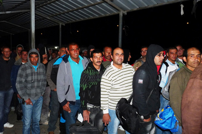 As many as 70,000 Palestinians commute each day between the West Bank and Israel [Khalid Amayreh/Al Jazeera]