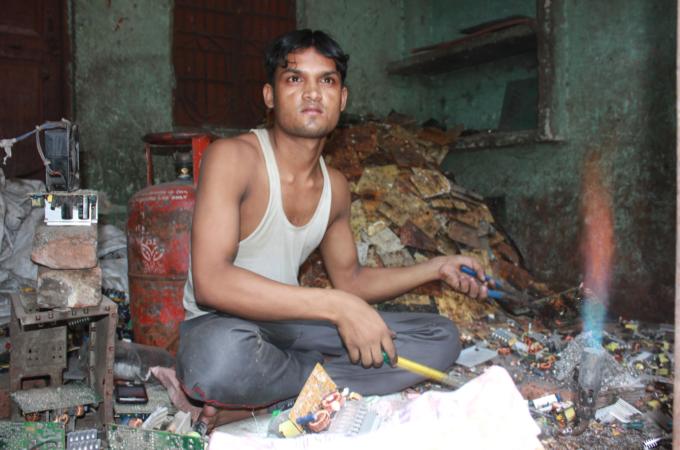 The government is clamping down on workers who resell wasted material from electronics [Kamala Kelkar/Al Jazeera]