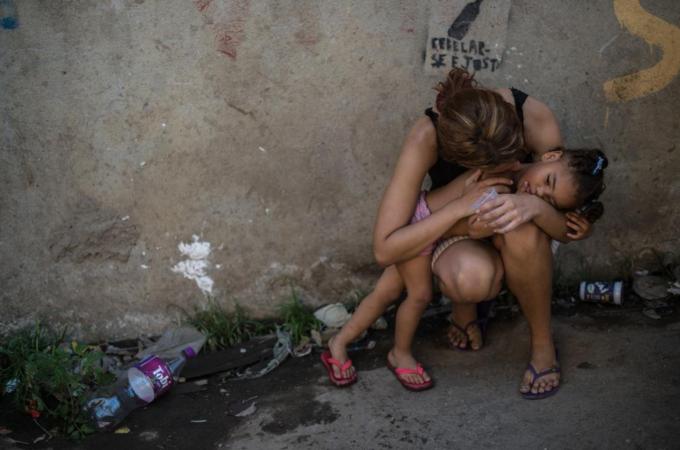Evictions in the Metro Mangueira favela near the Maracana Stadium affect thousands of poor families [AFP]