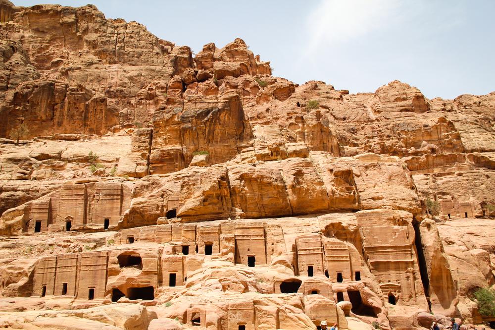 <p>Traditional rock-cut Nabatean tombs can be seen along the lower part of the ancient city of Petra.</p>