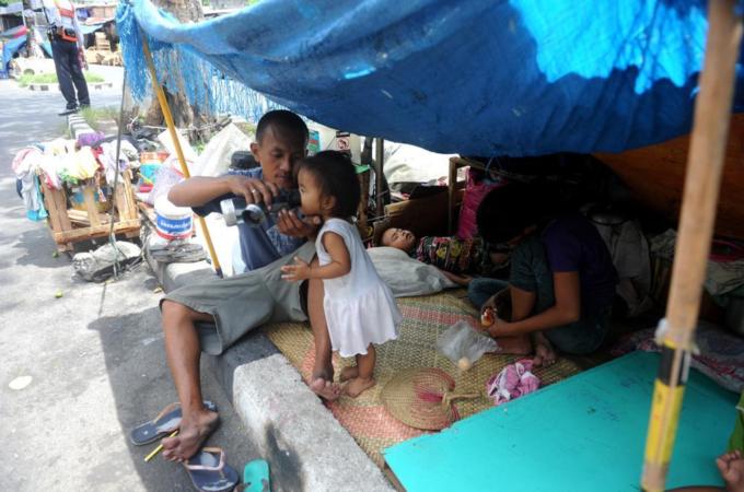 The Philippines' economic boom has not improved much the lives of the poor majority [AFP/Getty Images]