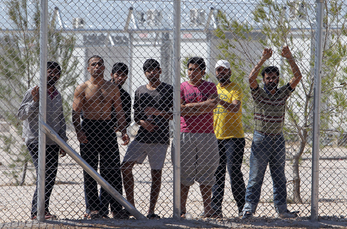 In Greece, an estimated 6,000 are held in immigration detentions camps and thousands more at police stations [AP]