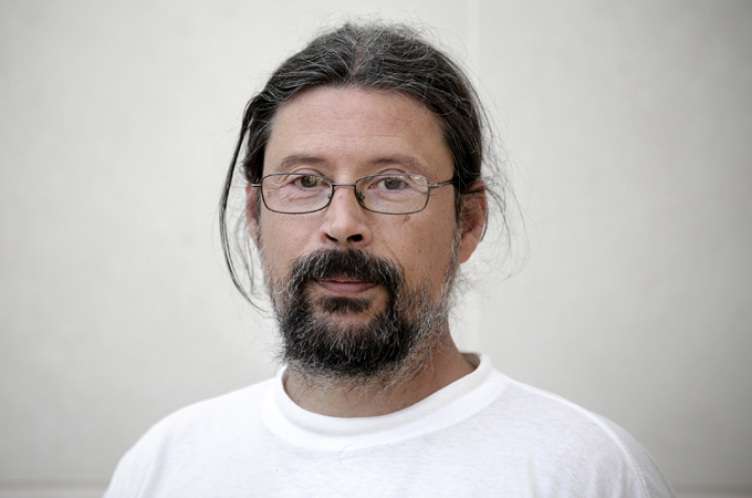 Father Agustin Rodriguez is determined to help drug addicts in the slum [Olmo Calvo Rodriguez/Al Jazeera]