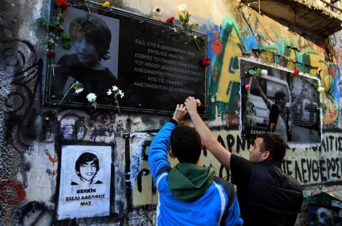 Students place flowers at the spot were teenager Alexandros Grigoropoulos was fatally shot by a Greek police officer  [EPA]