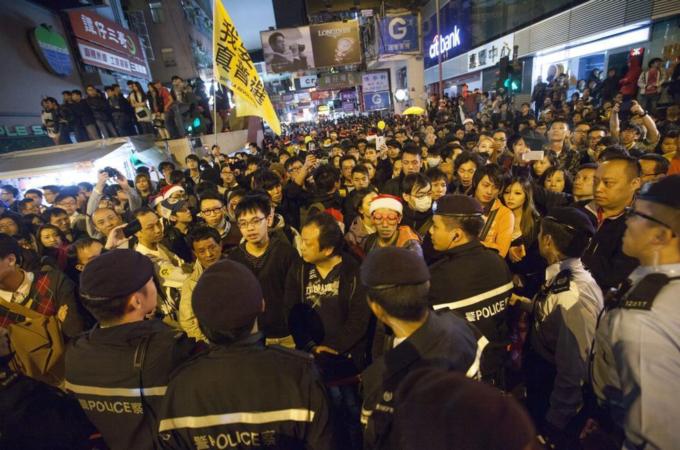 Police used pepper spray and batons to break up Wednesday's protest in Mong Kok neighbourhood [EPA]