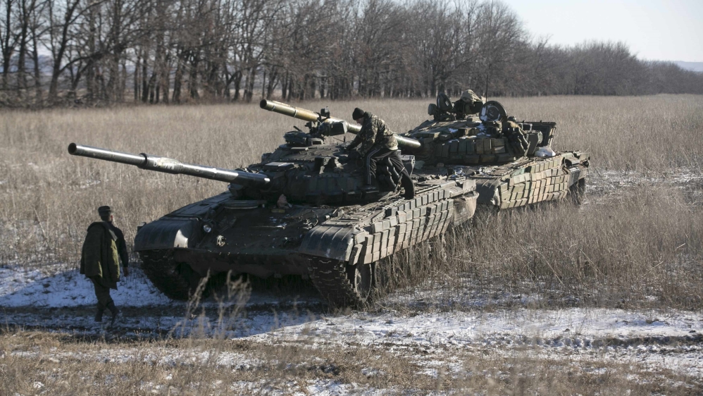 Tank crews of the separatist self-proclaimed Donetsk People''s Republic Army stand on top of their tanks at a checkpoint on the road from Vuhlehirsk to Debaltseve