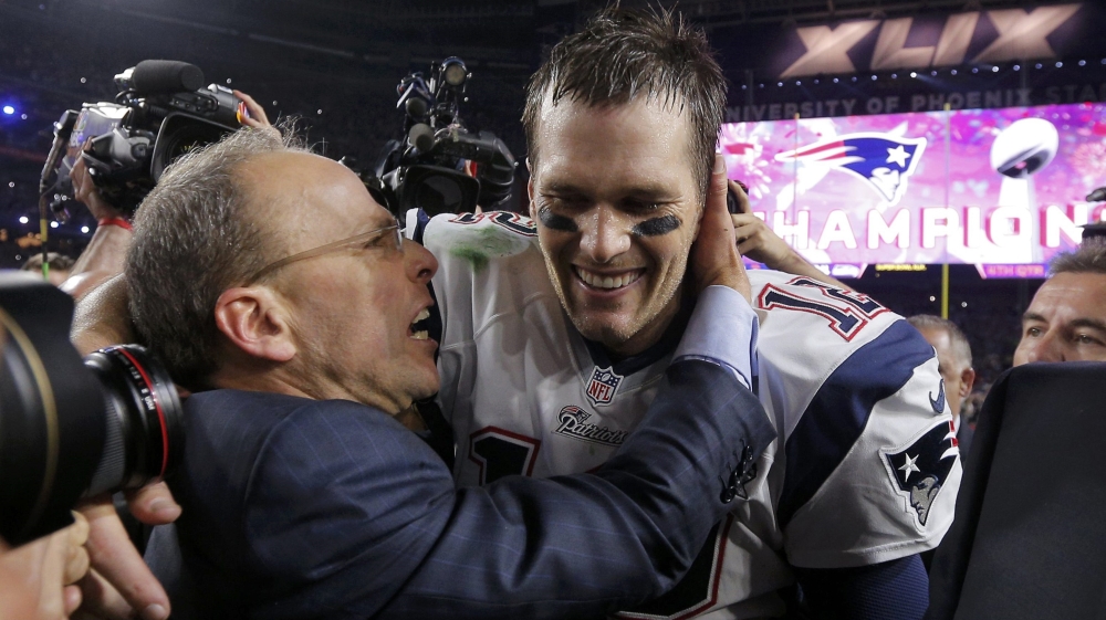 New England Patriots quarterback Tom Brady is congratulated by team president Jonathan Kraft after defeating the Seattle Seahawks in the NFL Super Bowl XLIX football game in Glendale
