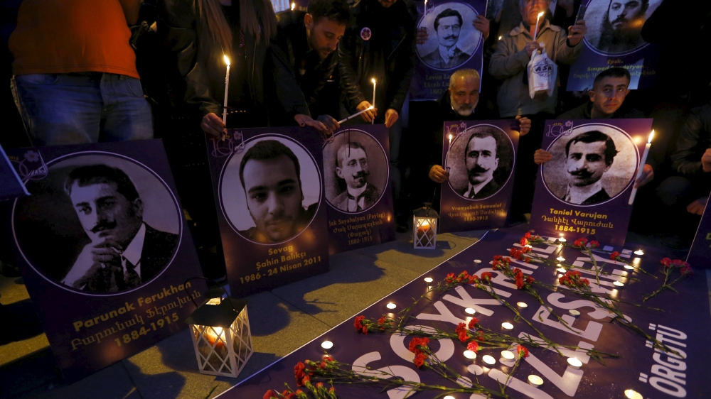 Demonstrators hold candles and pictures of Armenian victims during a commemoration for the victims of mass killings of Armenians by Ottoman Turks, in Istanbul [REUTERS]