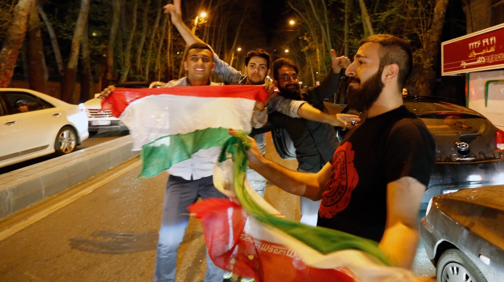 Iranians celebrate after nuclear talks in the street of Tehran [EPA]
