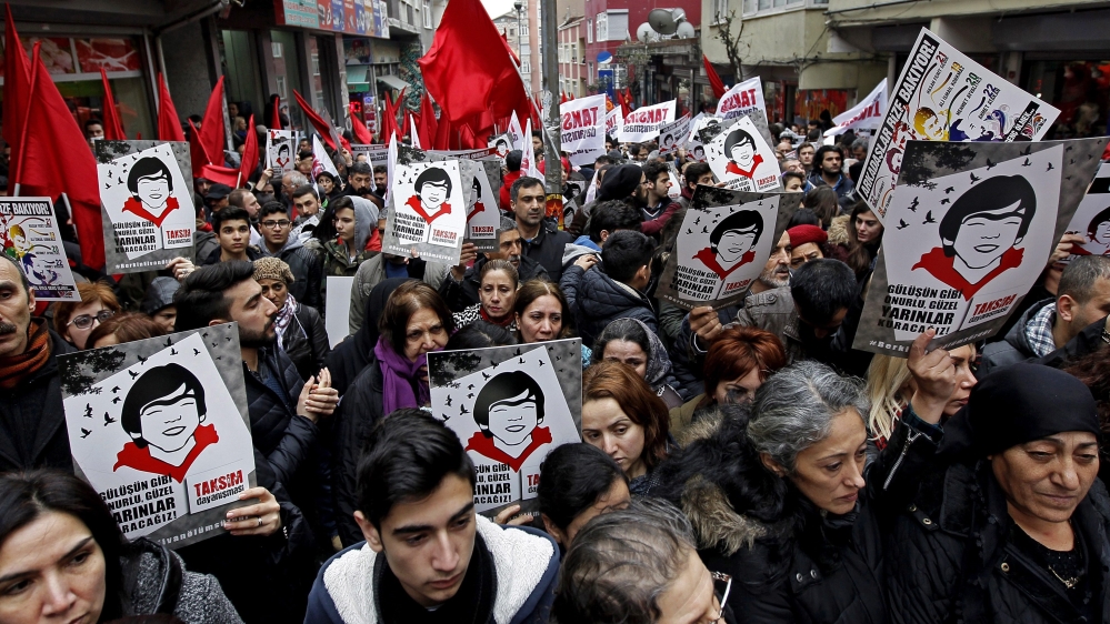 People march with posters bearing the picture of slain Berkin Elvan during a rally marking first anniversary of his death in Istanbul [EPA]