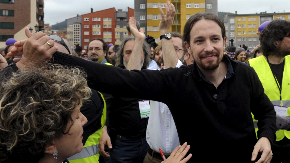 Podemos Secretary General Pablo Iglesias waves as he arrives at an electoral meeting in Oviedo, Spain [REUTERS]