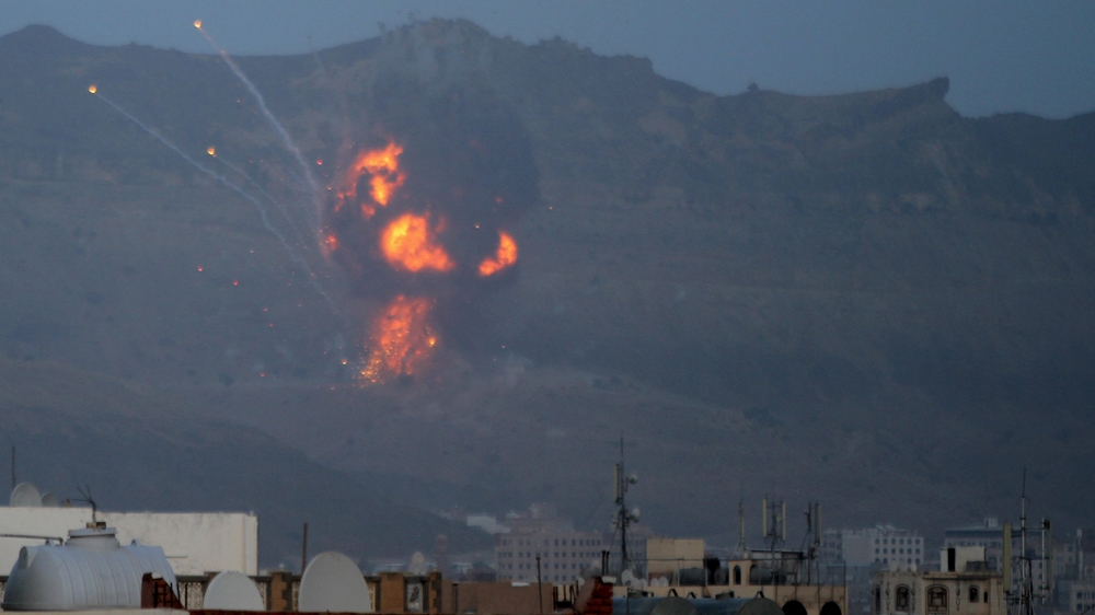 An explosion is seen from the Noqum Mountain after it was hit by an air strike in Yemen''s capital Sanaa