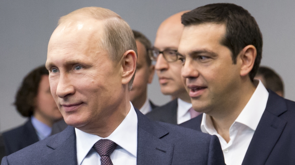 Russian President Vladimir Putin and Greek Prime Minister Alexis Tsipras arrive for their talks at the St. Petersburg International Investment Forum in St. Petersburg, Russia [AP]