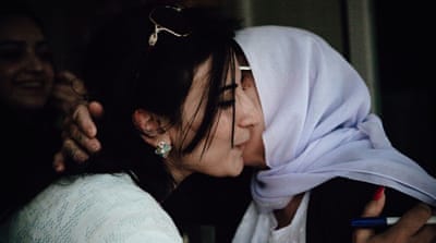 Seedo greets a distant family member from Sinjar who now lives in Rwanga refugee camp [Andrea DiCenzo/Al Jazeera]