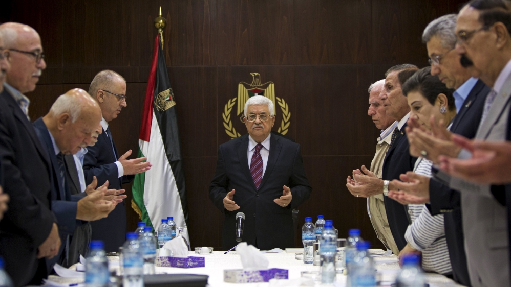 Palestinian President Mahmoud Abbas joins a reading of the Koran prior to a meeting of the Palestinian Liberation Organization (PLO) executive committee in the West Bank city of Ramallah [REUTERS]