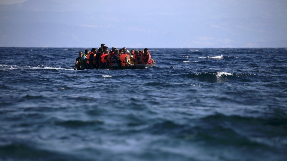 Syrian refugees on a dinghy approach, in rough seas, a beach on the island of Lesbos, Greece [REUTERS]