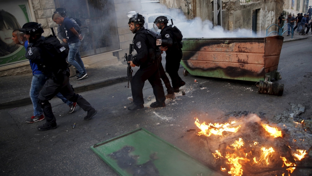 Israel police detain an Israeli Arab man during clashes in Nazareth at northern Israel