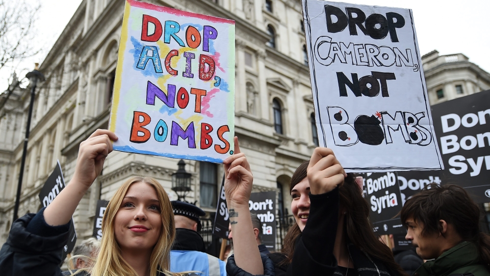 Demonstrators protest against British bombing of Syria outside Downing Street in London [EPA]