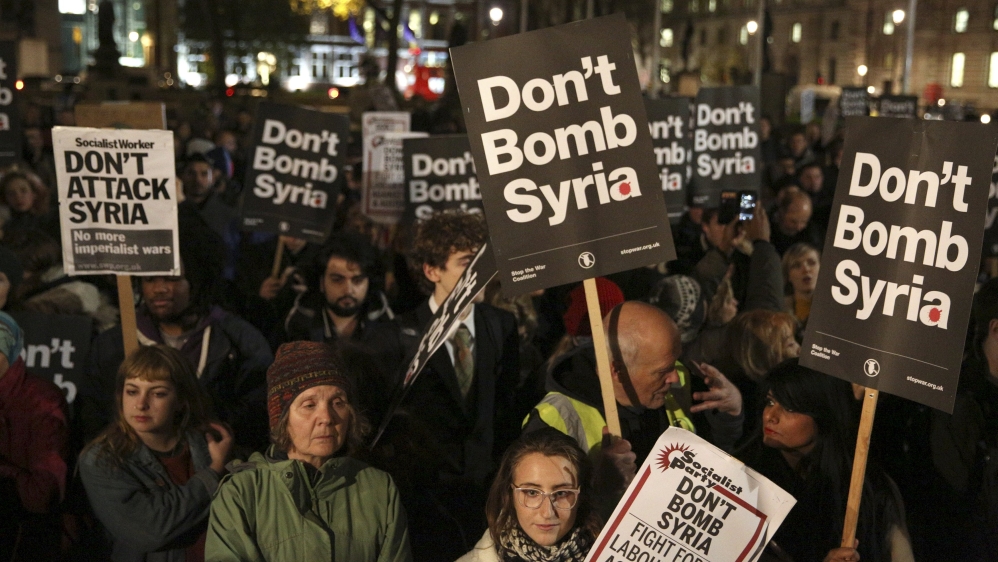 Anti-war protesters demonstrate against proposals to bomb Syria outside the Houses of Parliament in London [REUTERS]
