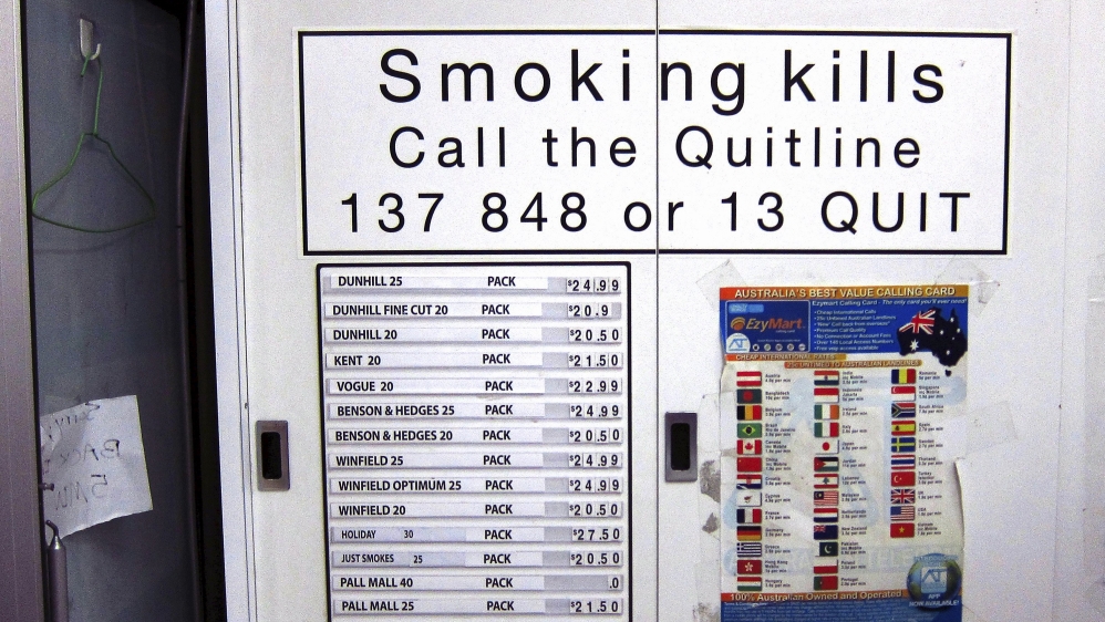 File photo of a cabinet containing cigarettes displaying their sale prices at a store located in central Sydney, Australia