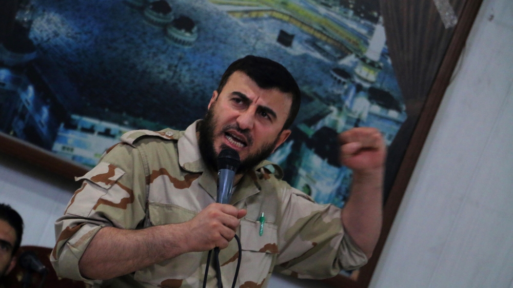 Zahran Alloush, commander of Jaysh al Islam, talks during a conference in the town of Douma, eastern Ghouta in Damascus