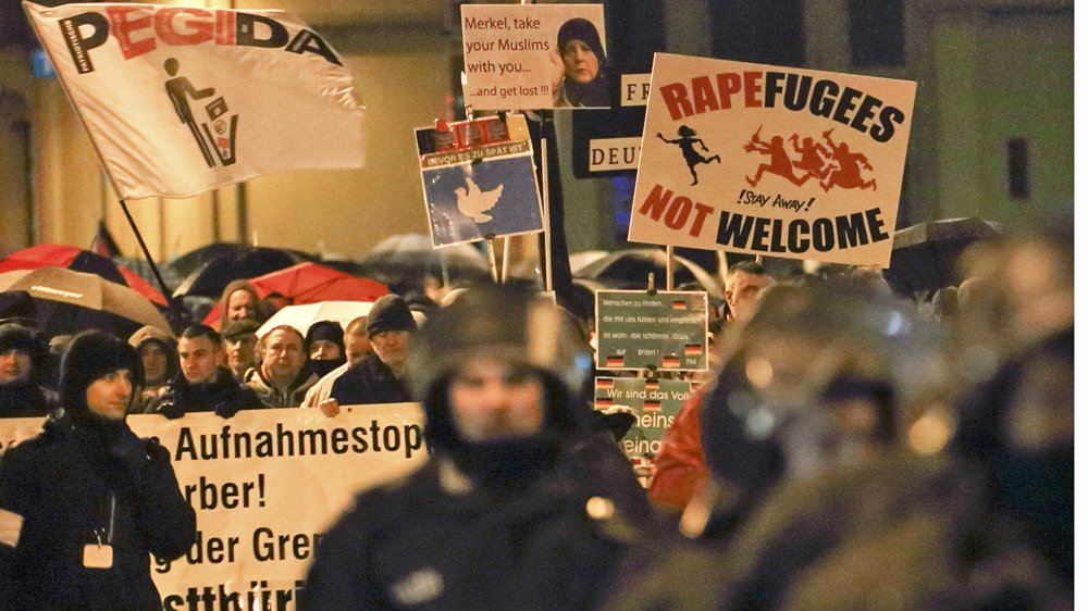 Members of LEGIDA, the Leipzig arm of the anti-Islam movement PEGIDA, take part in a rally in Leipzig