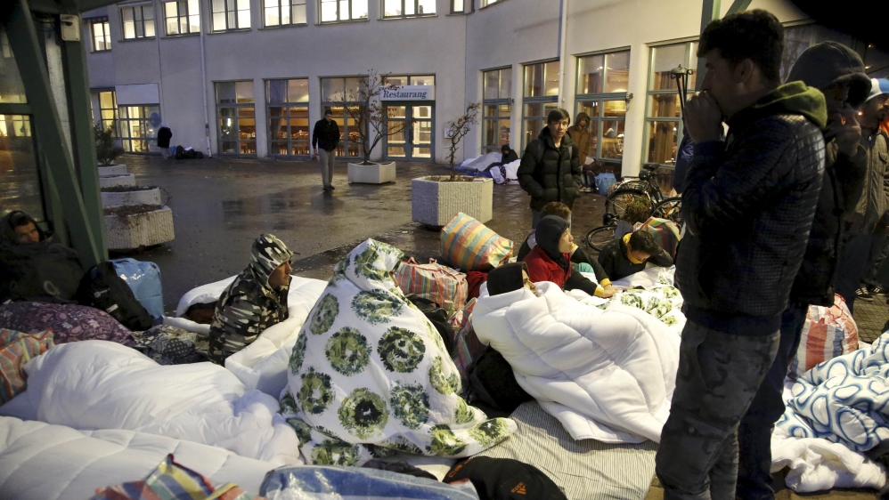 Refugees sleep outside the entrance of the Swedish Migration Agency''s arrival center for asylum seekers at Jagersro in Malmo