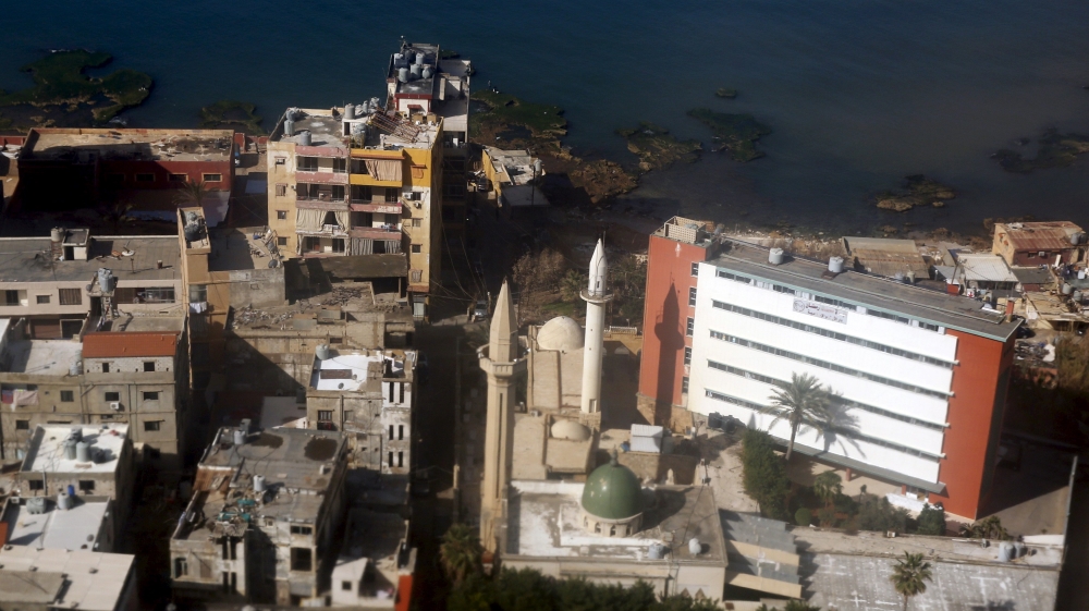 An aerial view of part of the coast with buildings of Beirut, is seen through the window of an airplane, Lebanon [REUTERS]