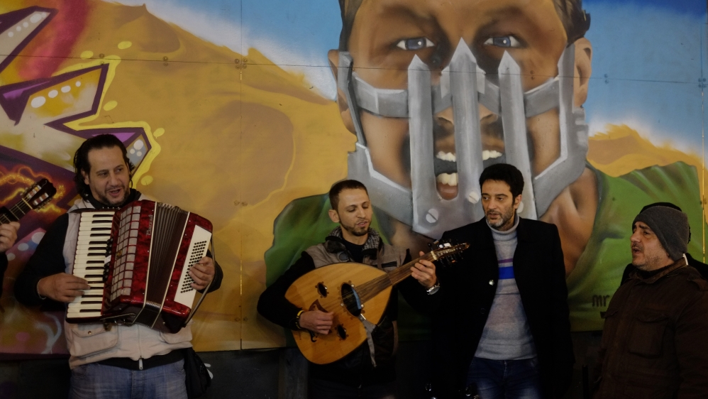 Musicians from Syria play Arabic songs for money in central Istanbul''s Istiklal Avenue [AP]