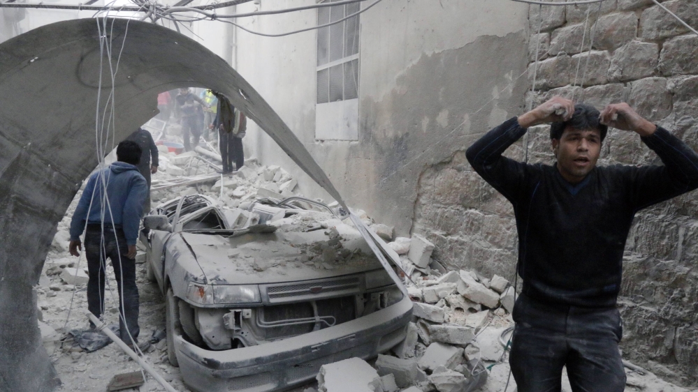 A man that survived shelling reacts amid damage after what activists said was an air strike by forces loyal to Syria''s president Al-Assad in the Al-Maysar neighborhood of Aleppo