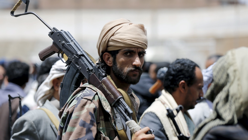 A tribesman loyal to the Houthi movement carries his rifle as he attends a gathering in Yemen''s capital Sanaa [REUTERS]
