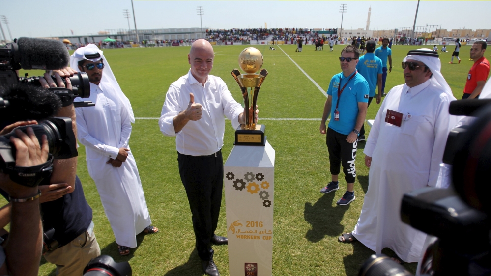 FIFA''s newly elected president Gianni Infantino poses with the Qatar Workers Cup trophy in Doha