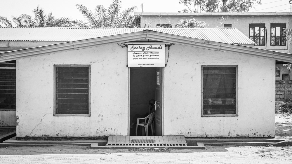 Seeing Hands opened in 2013 - and has managed to survive despite the war [Zach Krahmer/Al Jazeera]