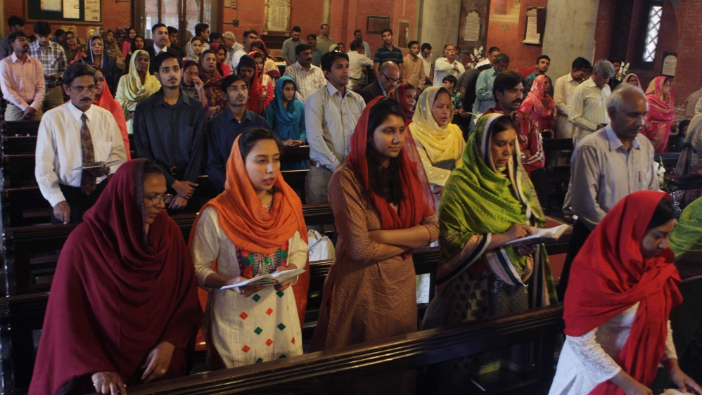 Pakistani Christians attend services for the victims of suicide bombing
