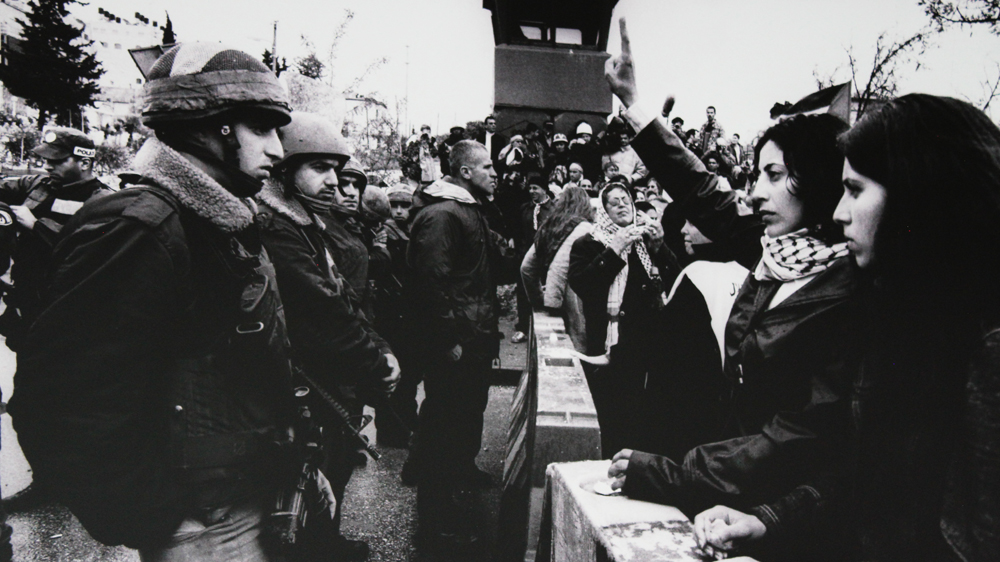 Ryuichi Hirokawa has spent decades documenting Palestinian history [Photo of Ryuichi Hirokawa exhibit/Jehan Alfarra/Al Jazeera]