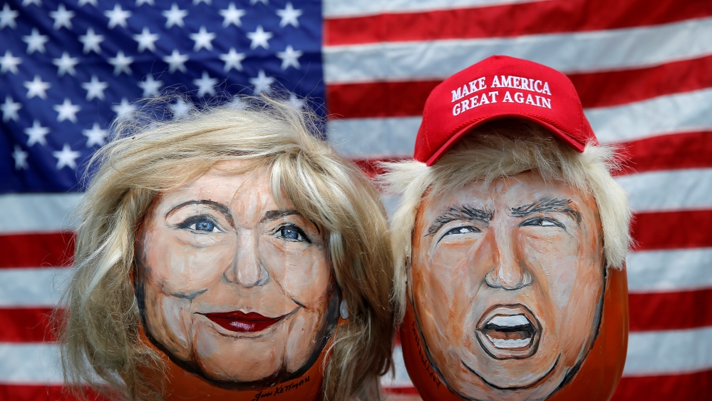 The images of US Democratic presidential candidate Hillary Clinton and Republican Presidential candidate Donald Trump are seen painted on decorative pumpkins [REUTERS]