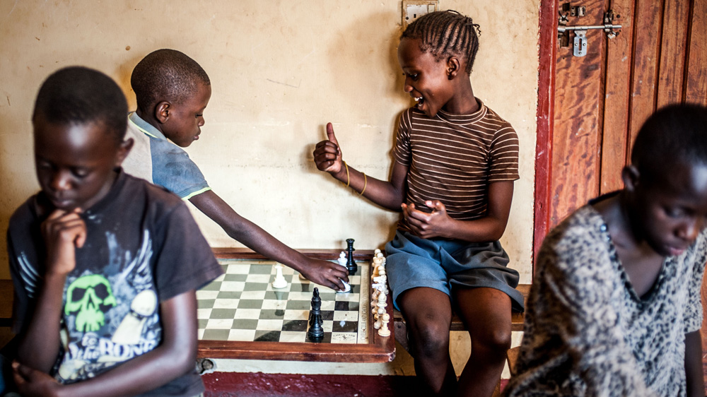 When the academy is open, up to 100 youngsters routinely turn up to challenge each other at chess [Aurelie Marrier d'Unienville/Al Jazeera]