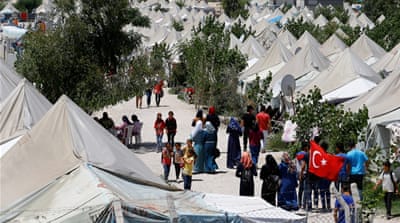 Syrian refugees stroll at a refugee camp in Osmaniye, Turkey [Reuters]