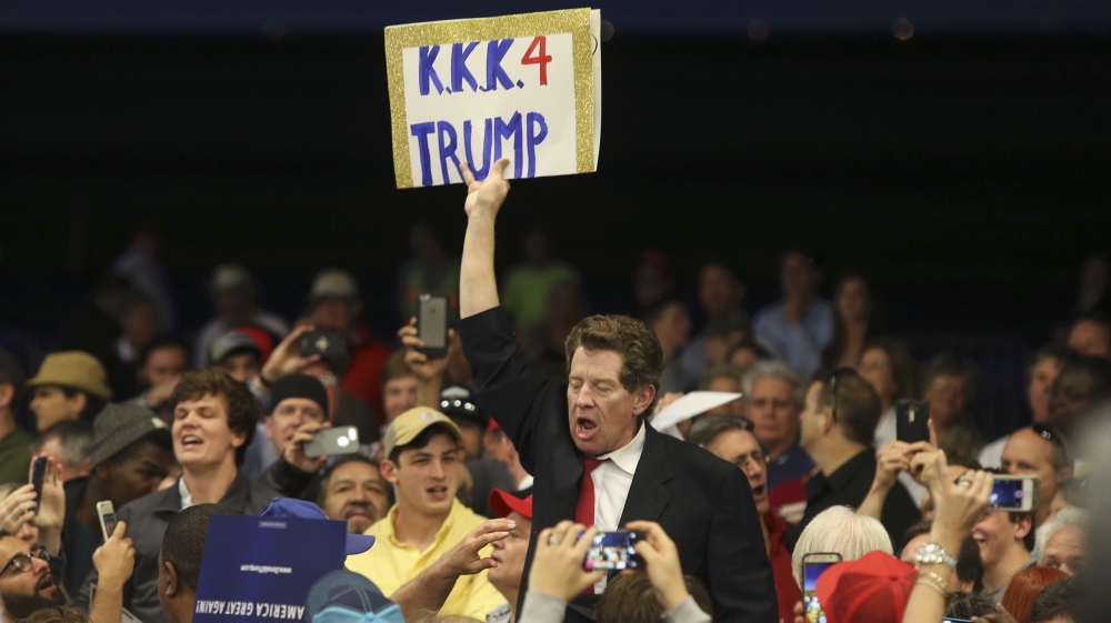 A protestor holds up a sign in the midst of Republican U.S. presidential candidate Donald Trump''s campaign rally in New Orleans, Louisiana