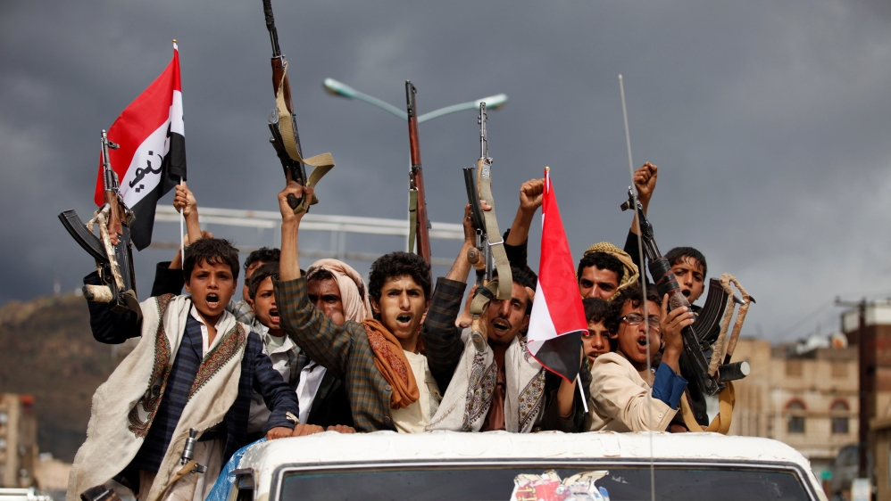 Armed men ride on the back of a truck to attend a rally held by supporters of Houthi rebels and Yemen''s former president Ali Abdullah Saleh in Sanaa, Yemen