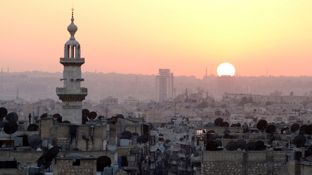The sun sets over Aleppo as seen from rebel-held part of the city, Syria [REUTERS]