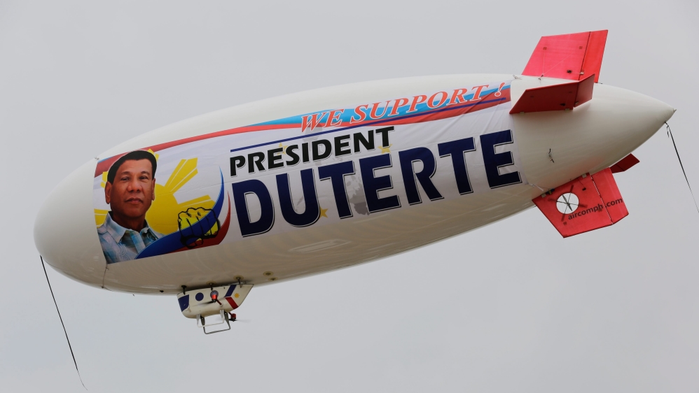 An unmanned aerial vehicle blimp with a banner supporting Philippine President Rodrigo Duterte flying along Manila Bay in Manila, Philippine [EPA]