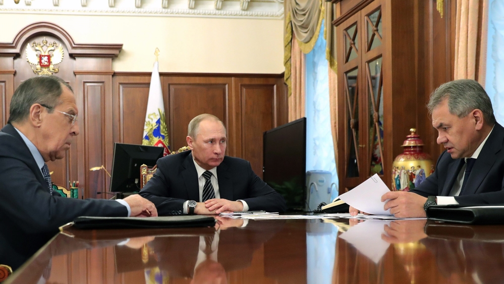 Russian President Vladimir Putin meets with Defense Minister Sergei Shoigu and Foreign Minister Sergei Lavrov