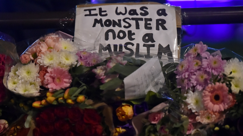 Floral tributes are seen in Westminster the day after an attack in London