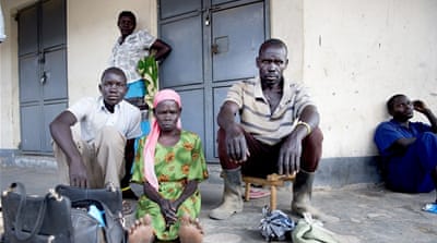 Moses Nyaya with his son and mother [Yilmaz Polat/Al Jazeera]