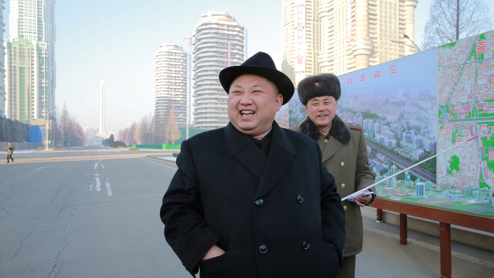 FILE PHOTO: KCNA photo of North Korean leader Kim Jong Un inspecting the construction site of Ryomyong Street